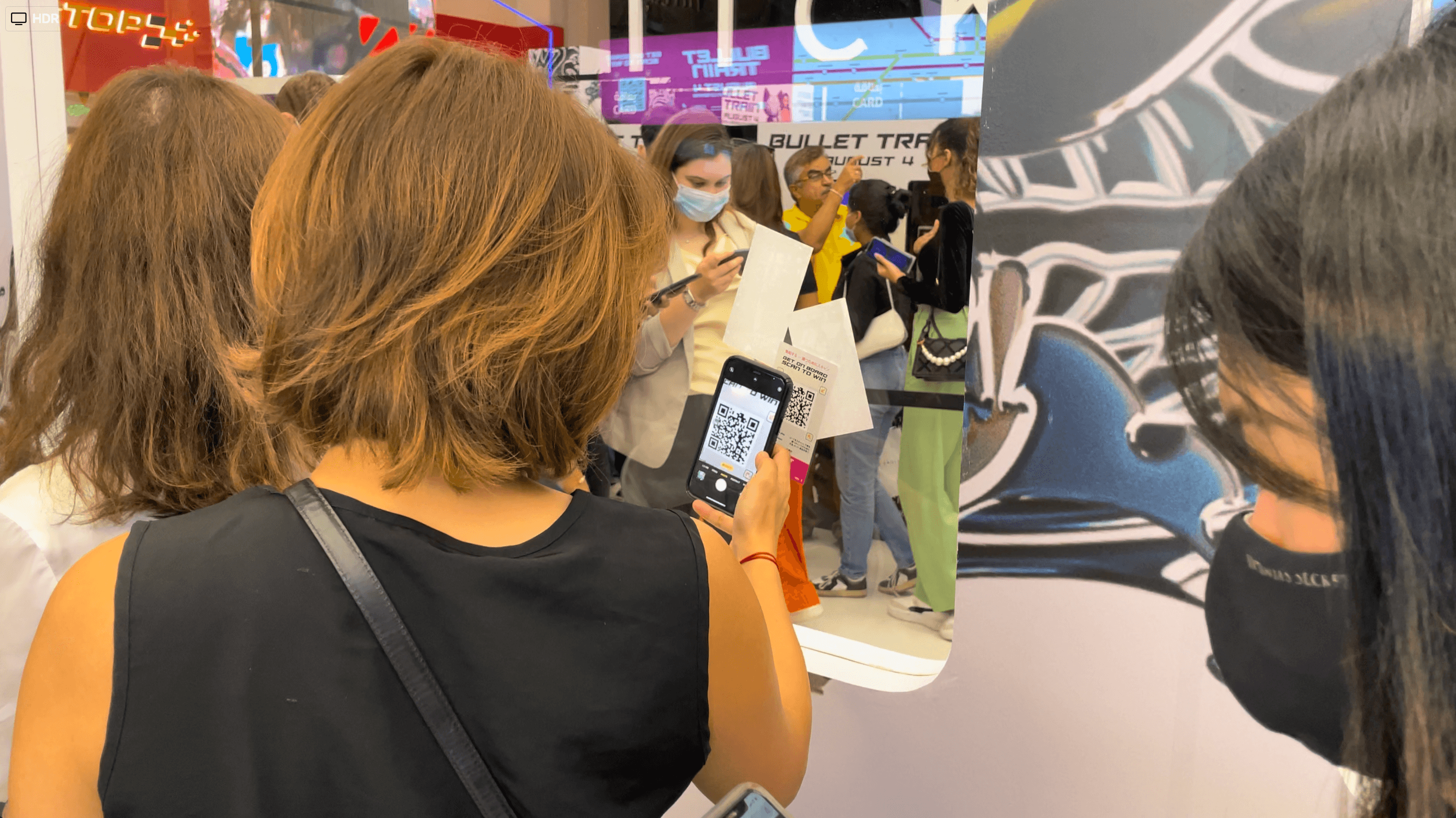 Moviegoer scans a QR Code at our Bullet Train Station Activation Moviegoer scans a QR Code at our Bullet Train Station Activation